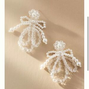 Pearl bow earrings from Anthropologie - brand is Sister Jane
